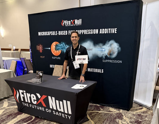 FireXNull tabletop exhibit at CTT Summit 2026 in Lombard, Illinois, featuring FXN-M200 microcapsule fire suppression additive